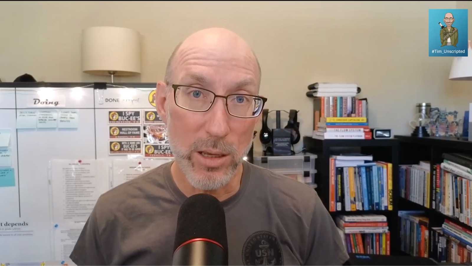 Tim Dickey speaking into a microphone during the Life Lessons Learned series, sharing leadership insights